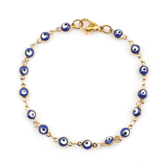 Gold charm bracelet with enamel evil eyes